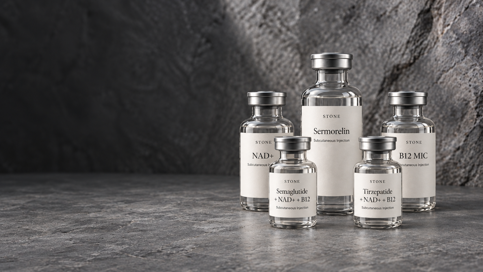 Glass peptide vials arranged on a dark stone surface