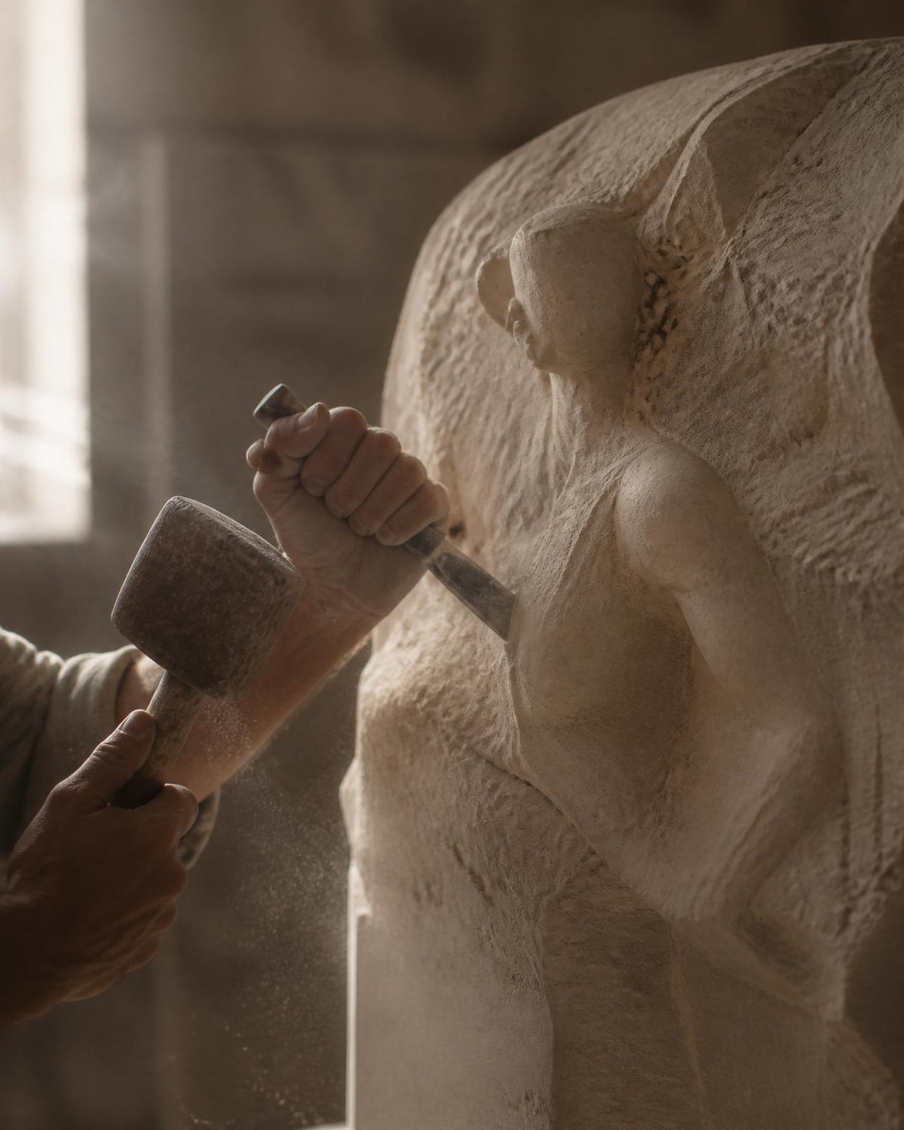Chisel carving a block of marble